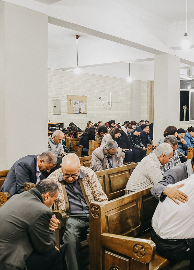 Men praying in a church in Egypt