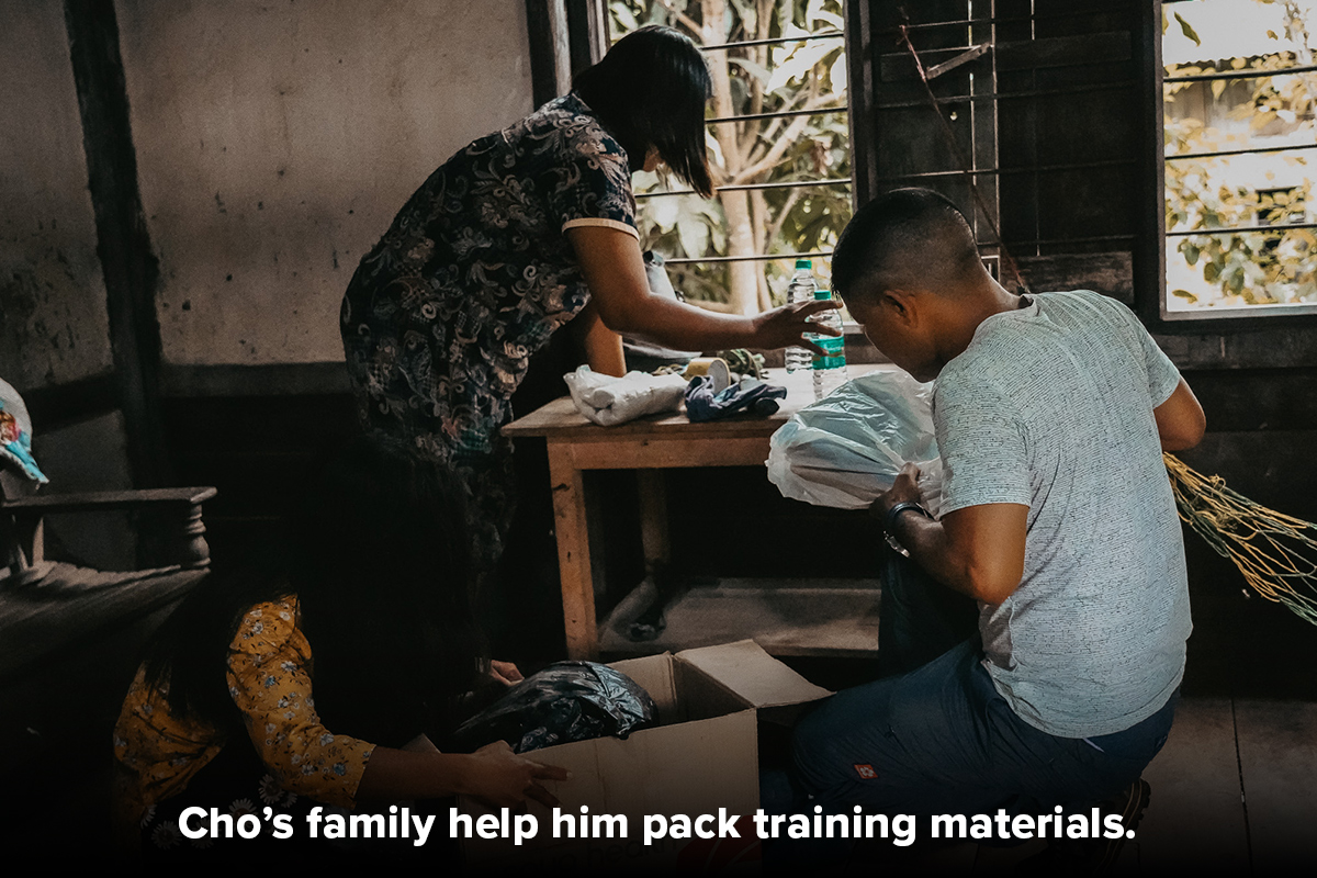 two people packing persecution preparedness training materials